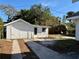 Detached garage with white siding and driveway at 2530 9Th W Ave, Bradenton, FL 34205