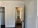Hallway showcasing hardwood floors and leading to different rooms at 2530 9Th W Ave, Bradenton, FL 34205