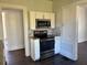 The kitchen includes stainless steel appliances, granite countertops, and sleek cabinets at 2530 9Th W Ave, Bradenton, FL 34205