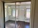 Enclosed front porch with large sliding windows and view of front door at 2530 9Th W Ave, Bradenton, FL 34205