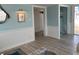 Hallway with a view of rooms, light paint, and light colored wood floors at 2601 Gulf N Dr # 221, Bradenton Beach, FL 34217
