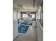 Open floor plan kitchen featuring a dining nook, white cabinets, and stainless appliances at 2601 Gulf N Dr # 221, Bradenton Beach, FL 34217