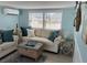 Relaxing living room with two couches, a wooden coffee table, and bright natural light at 2601 Gulf N Dr # 221, Bradenton Beach, FL 34217