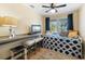 Cozy bedroom with ample workspace, storage, and comfortable seating for relaxing or studying at 2728 Trinidad St, Sarasota, FL 34231