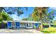 This blue home has stone accents and great curb appeal, enhancing its charm at 2728 Trinidad St, Sarasota, FL 34231