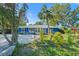 Charming blue single story home with lush landscaping and ample parking at 2728 Trinidad St, Sarasota, FL 34231