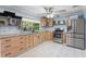 Bright kitchen with stainless steel appliances, lots of cabinets, and a large window at 2728 Trinidad St, Sarasota, FL 34231
