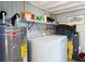 Functional laundry room with modern washer and dryer, shelving for storage, and utility sink for added convenience at 2728 Trinidad St, Sarasota, FL 34231
