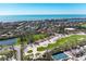 Beautiful aerial shot showcasing golf and tennis courts, beach access, and coastal living at 3111 Bayou Sound, Longboat Key, FL 34228