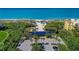 Aerial view of beach access point with boardwalk, parking, and beachfront amenities at 3111 Bayou Sound, Longboat Key, FL 34228
