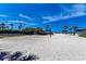 Sunny beach volleyball court, perfect for recreation and enjoying the coastal lifestyle at 3111 Bayou Sound, Longboat Key, FL 34228