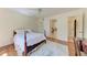 Bedroom with hardwood floors, ceiling fan, and closet at 3111 Bayou Sound, Longboat Key, FL 34228