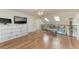 Spacious hallway with hardwood floors and decorative wrought iron railing at 3111 Bayou Sound, Longboat Key, FL 34228