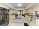 Bright kitchen with granite countertops, white cabinetry, and stainless steel appliances at 3111 Bayou Sound, Longboat Key, FL 34228