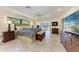 Spacious main bedroom with tile floors, ceiling fan, and access to a private balcony at 3111 Bayou Sound, Longboat Key, FL 34228