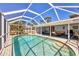 Screened-in pool area featuring a patio and access to the home's outdoor living spaces at 3124 Tanglewood Dr, Sarasota, FL 34239