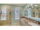 Spacious bathroom with double sinks, granite countertops, and a glass enclosed shower at 314 Bay S Dr # 5, Bradenton Beach, FL 34217