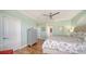 Bright bedroom with hardwood floors, a large dresser, and coastal decor at 314 Bay S Dr # 5, Bradenton Beach, FL 34217