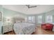 Comfortable bedroom with hardwood floors, shuttered windows, and a queen sized bed at 314 Bay S Dr # 5, Bradenton Beach, FL 34217