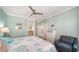 A well-lit bedroom with a queen-sized bed and decorative beach-themed accents at 314 Bay S Dr # 5, Bradenton Beach, FL 34217
