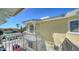 Exterior view of the side of the home showing stairs leading to a second story balcony at 314 Bay S Dr # 5, Bradenton Beach, FL 34217