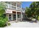Delightful two-story exterior with inviting shopfronts, perfect for a charming day out at 314 Bay S Dr # 5, Bradenton Beach, FL 34217