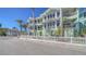 Beautiful three story waterfront home with multiple balconies and a well manicured fenced front yard at 314 Bay S Dr # 5, Bradenton Beach, FL 34217