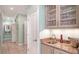 Hallway with bar, sink, granite countertop, and glass storage for glasses at 314 Bay S Dr # 5, Bradenton Beach, FL 34217