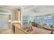 Open kitchen and living space featuring granite countertops and stainless steel sink with waterfront view at 314 Bay S Dr # 5, Bradenton Beach, FL 34217