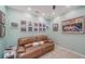 A cozy living room with comfortable seating and Gathering pictures displayed on the walls at 314 Bay S Dr # 5, Bradenton Beach, FL 34217