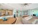 Open-concept living space with kitchen, dining area, and beautiful waterfront views from multiple windows at 314 Bay S Dr # 5, Bradenton Beach, FL 34217