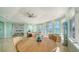 Expansive living space with a dining area, comfortable seating, and stunning panoramic waterfront views at 314 Bay S Dr # 5, Bradenton Beach, FL 34217