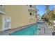 Inviting outdoor pool and hot tub on wooden deck, perfect for relaxation and entertainment at 314 Bay S Dr # 5, Bradenton Beach, FL 34217