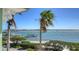 Picturesque view of the waterfront showcasing boats docked near the shore and clear blue skies at 314 Bay S Dr # 5, Bradenton Beach, FL 34217