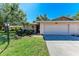 Inviting single-story home with manicured lawn and garden, featuring a 2-car garage and well-lit entryway at 3549 Wilkinson Woods Dr # 38, Sarasota, FL 34231