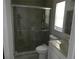 Compact bathroom with a glass-enclosed shower and vanity sink, plus storage at 361 Yorkshire St, Port Charlotte, FL 33954