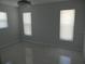 Bright bedroom with two windows, offering ample natural light at 361 Yorkshire St, Port Charlotte, FL 33954