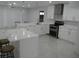 Bright kitchen with stainless steel appliances, white cabinets, and an island with bar stool seating at 361 Yorkshire St, Port Charlotte, FL 33954