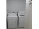 Functional laundry room with a washing machine and dryer, offering convenience at 361 Yorkshire St, Port Charlotte, FL 33954