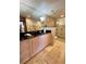 Bathroom featuring elegant vanity, black countertop, and walk-in shower with glass doors at 3630 Gulf Of Mexico Dr # 304, Longboat Key, FL 34228