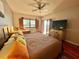 Comfortable bedroom featuring water views, wooden shutters, and bright natural light at 3630 Gulf Of Mexico Dr # 304, Longboat Key, FL 34228