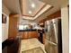 Kitchen features wood cabinetry, granite countertops, and stainless steel appliances at 3630 Gulf Of Mexico Dr # 304, Longboat Key, FL 34228