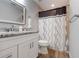 Bathroom showcasing a single sink vanity, toilet, and tub/shower combination at 3804 Sun Eagle Ln, Bradenton, FL 34210