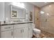 Modern bathroom with large glass shower, beautiful light fixtures, and gorgeous stone floors at 3804 Sun Eagle Ln, Bradenton, FL 34210