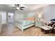 Bright bedroom featuring light colored floors and adjoining bathroom at 3804 Sun Eagle Ln, Bradenton, FL 34210