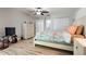Spacious bedroom featuring light colored floors, closet space, and a bathroom at 3804 Sun Eagle Ln, Bradenton, FL 34210