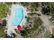 Stunning aerial view of the community pool featuring lounging chairs and a hot tub at 3804 Sun Eagle Ln, Bradenton, FL 34210