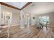 Bright dining area featuring a glass table, seating for four, and flows into the kitchen area at 3804 Sun Eagle Ln, Bradenton, FL 34210