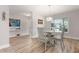Bright dining area featuring a glass table, seating for four, and modern decor at 3804 Sun Eagle Ln, Bradenton, FL 34210