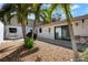 Outdoor patio featuring decorative rock garden and tropical plants at 3804 Sun Eagle Ln, Bradenton, FL 34210